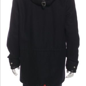 Sandro Wool Parka
With Hood
Faux Fur Trim & Collar
Flap Pockets & Zip Closure